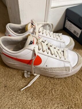 Nike Women's White Leather Low-Top Sneakers with Orange Swoosh